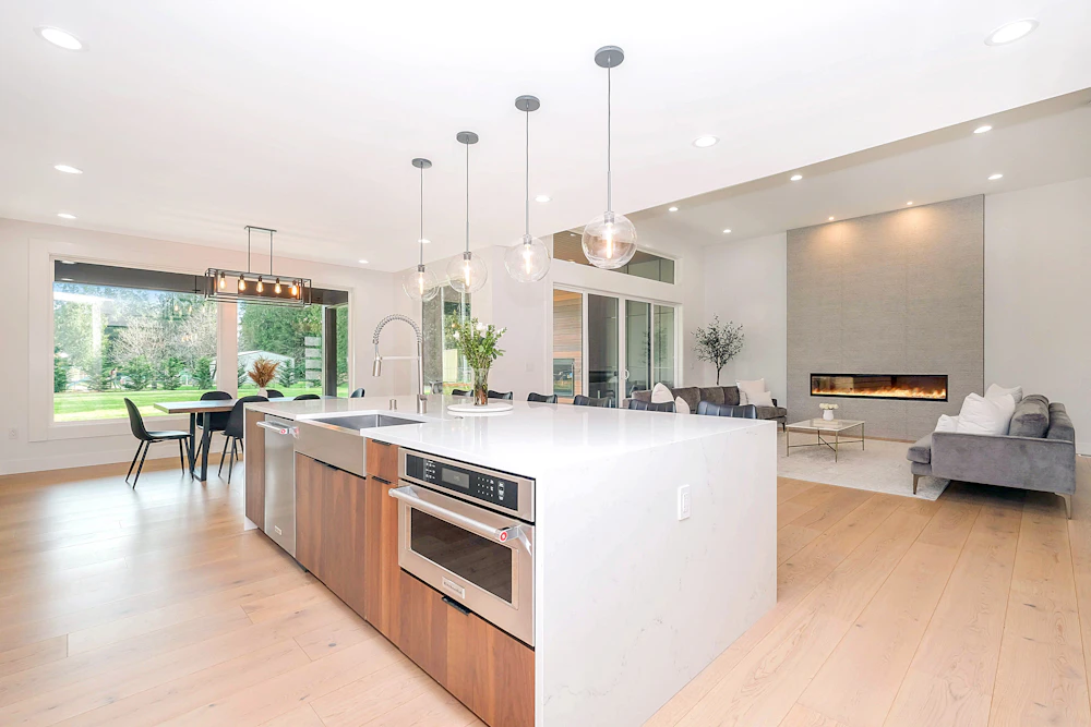 After: bright modern kitchen with island and pendant lighting