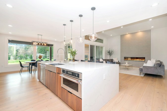 Bright modern kitchen with island and new cabinetry in a recently built home