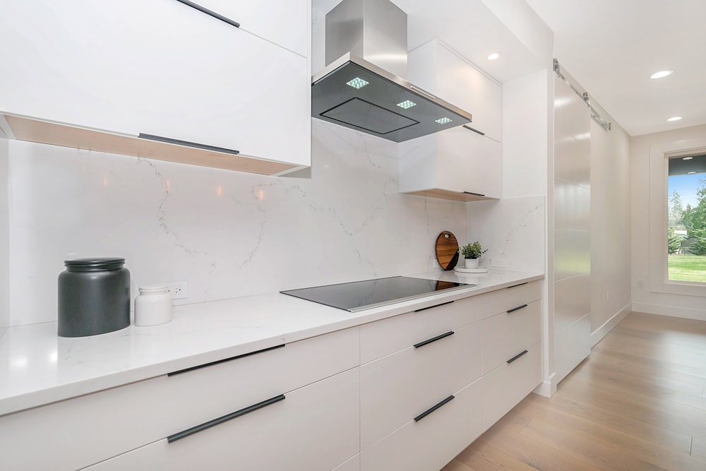 white and black wooden kitchen cabinet