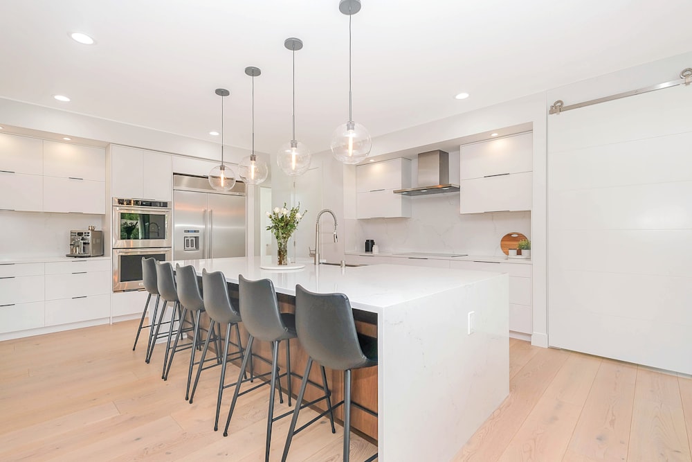 white wooden table with chairs