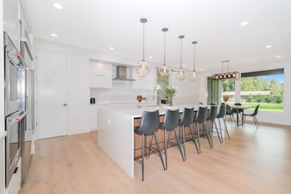 white wooden table with chairs