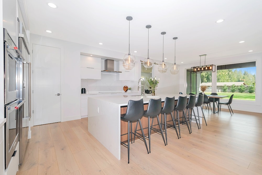 white wooden table with chairs