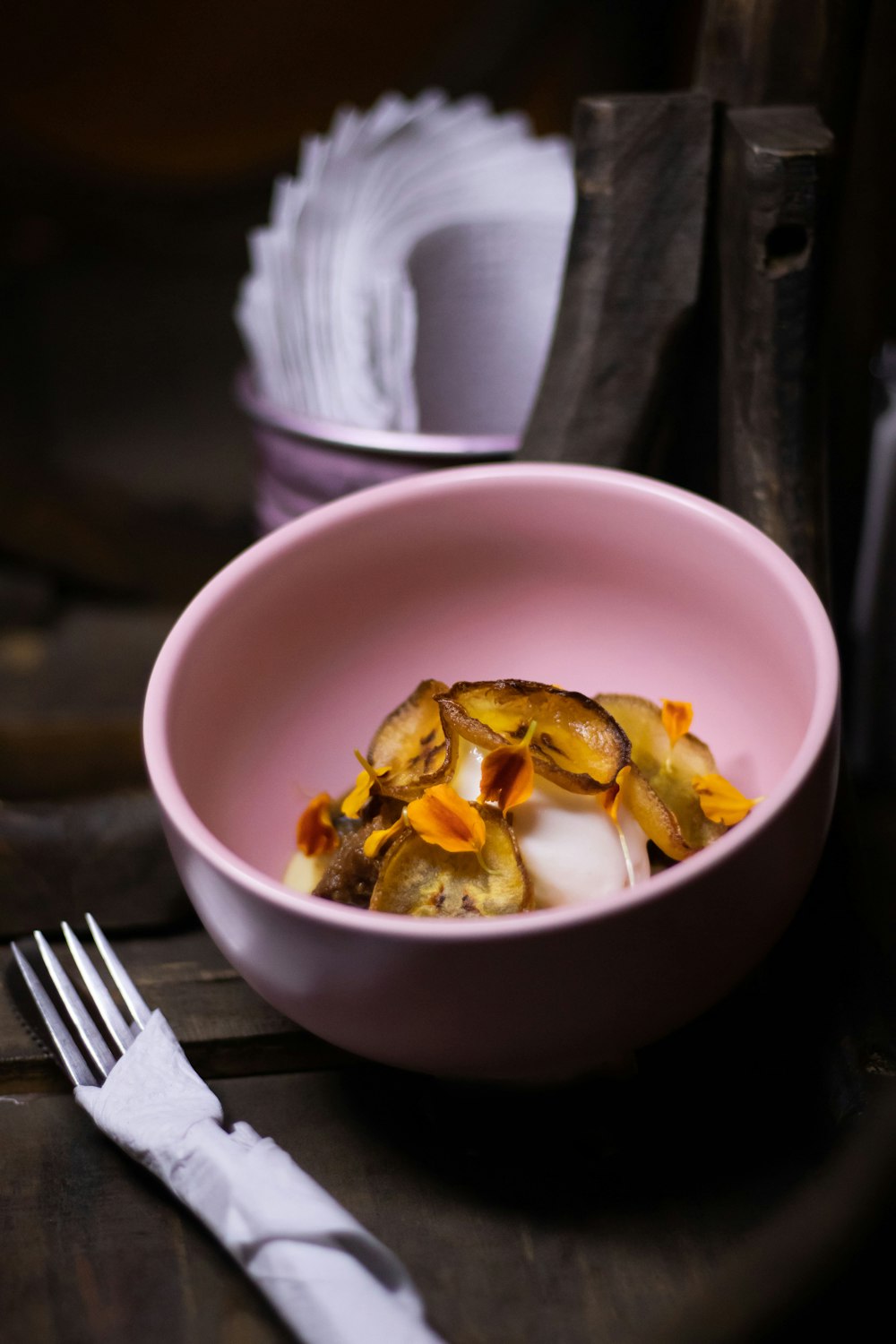 stainless steel fork on white ceramic bowl