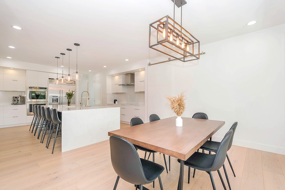 white wooden table with chairs