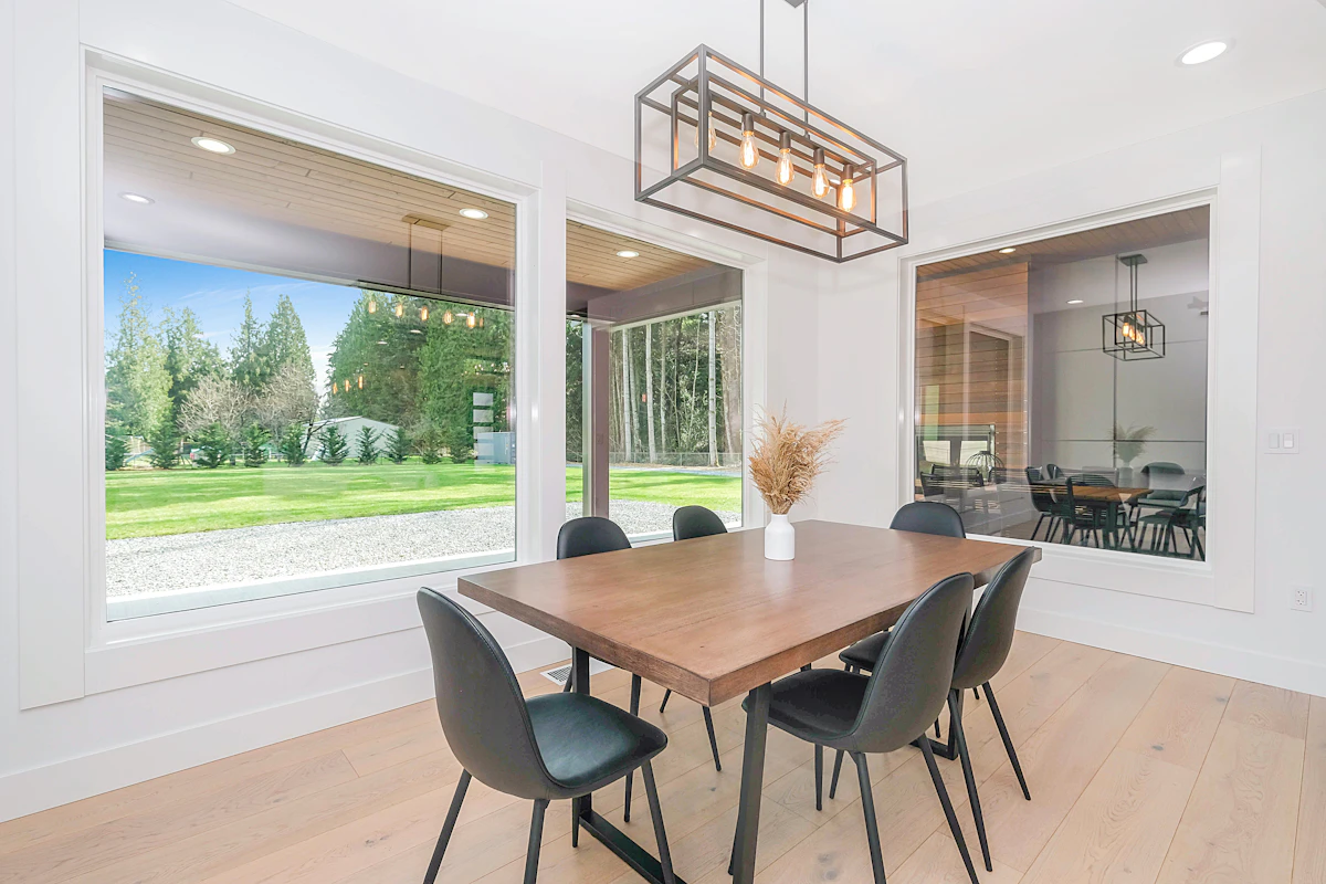 Bright dining room with new large windows after installation