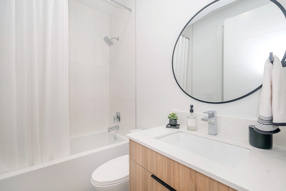 white ceramic sink with stainless steel faucet