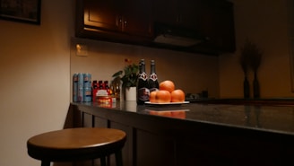 A cozy kitchen counter with fresh sourdough bread, a glass of homemade beer, and cocktail ingredients arranged invitingly.