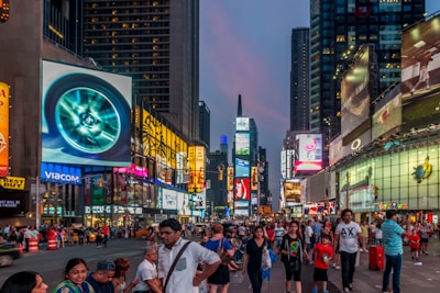 people walking on street during nighttime