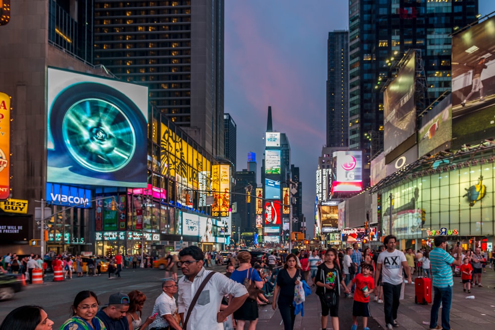 people walking on street during nighttime