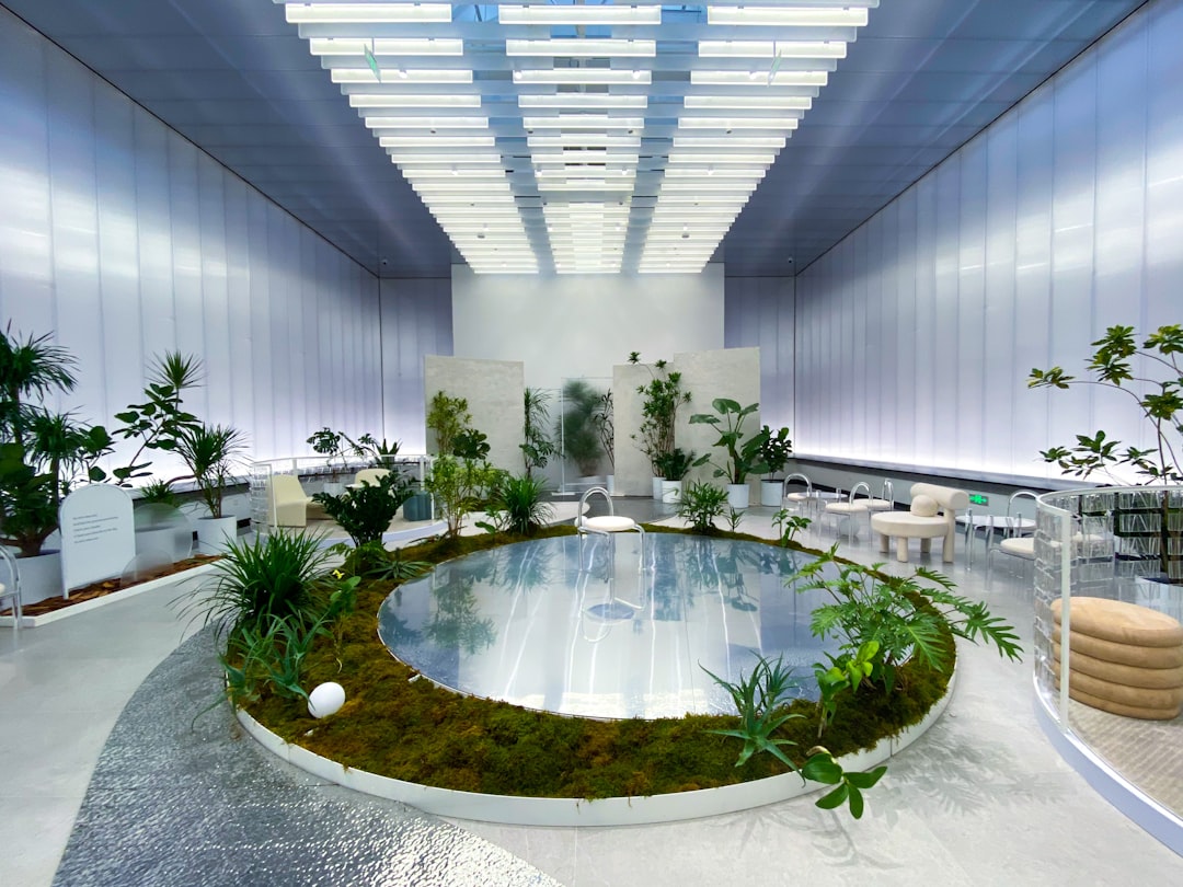 green plants on brown concrete round fountain