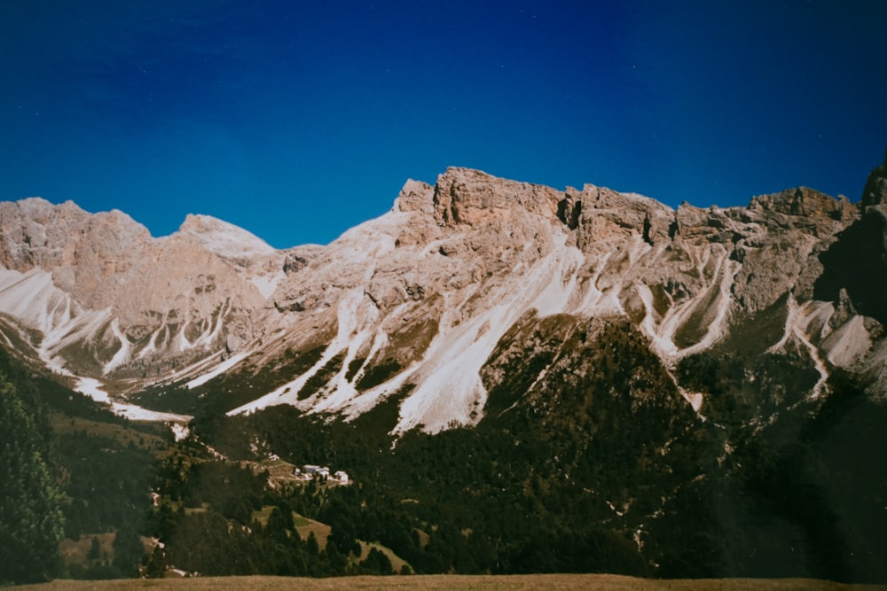 snow covered mountain under blue sky during daytime