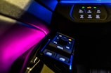 Brightly lit car interior highlighting personalized dashboard panels and controls.