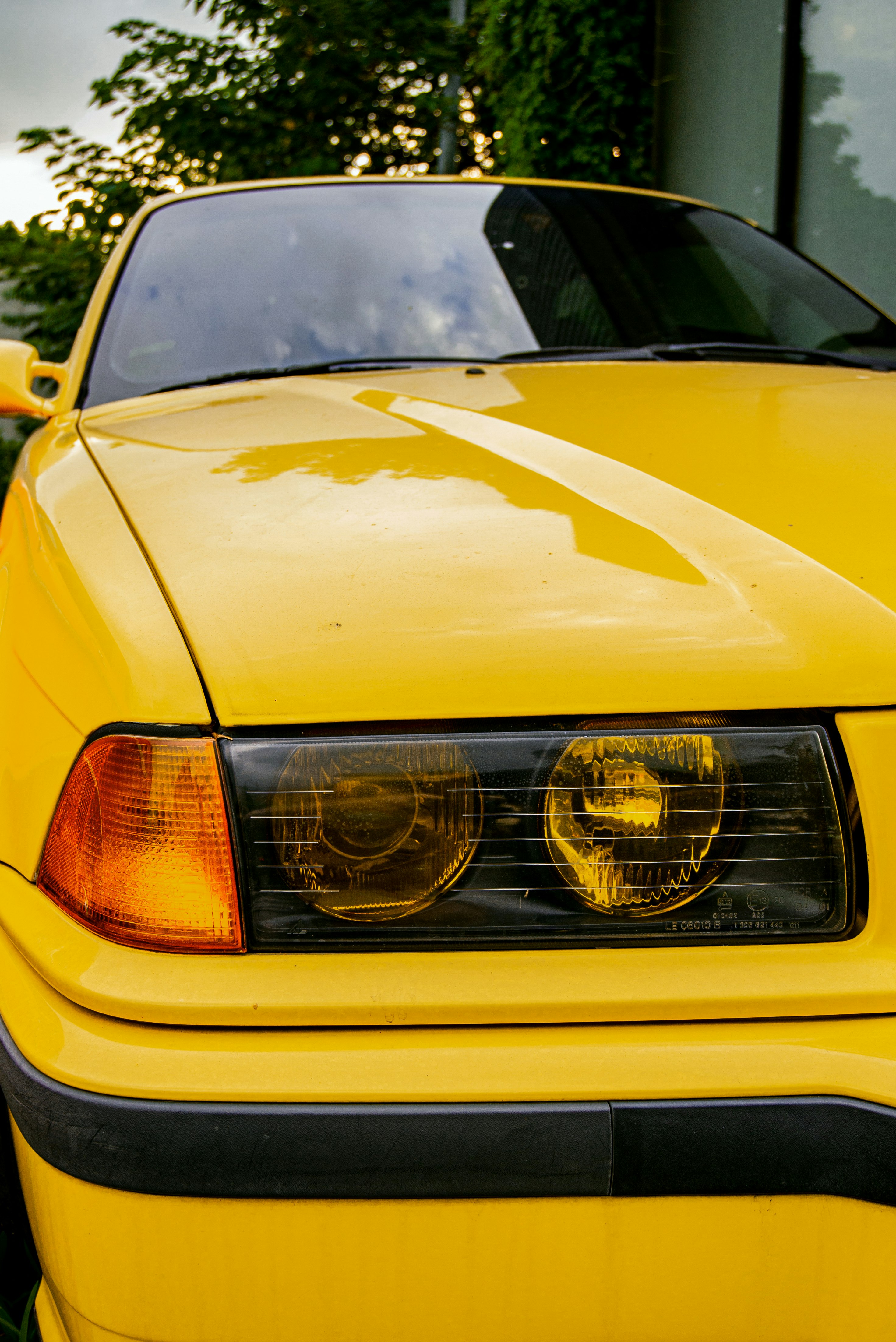yellow car with silver grille