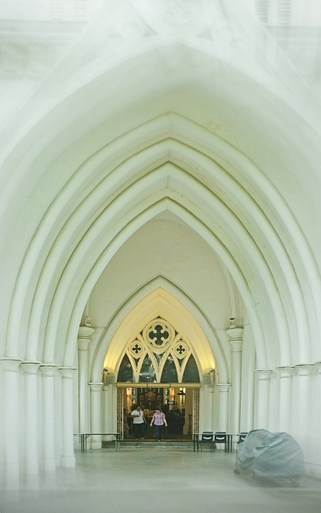 white concrete building with glass windows