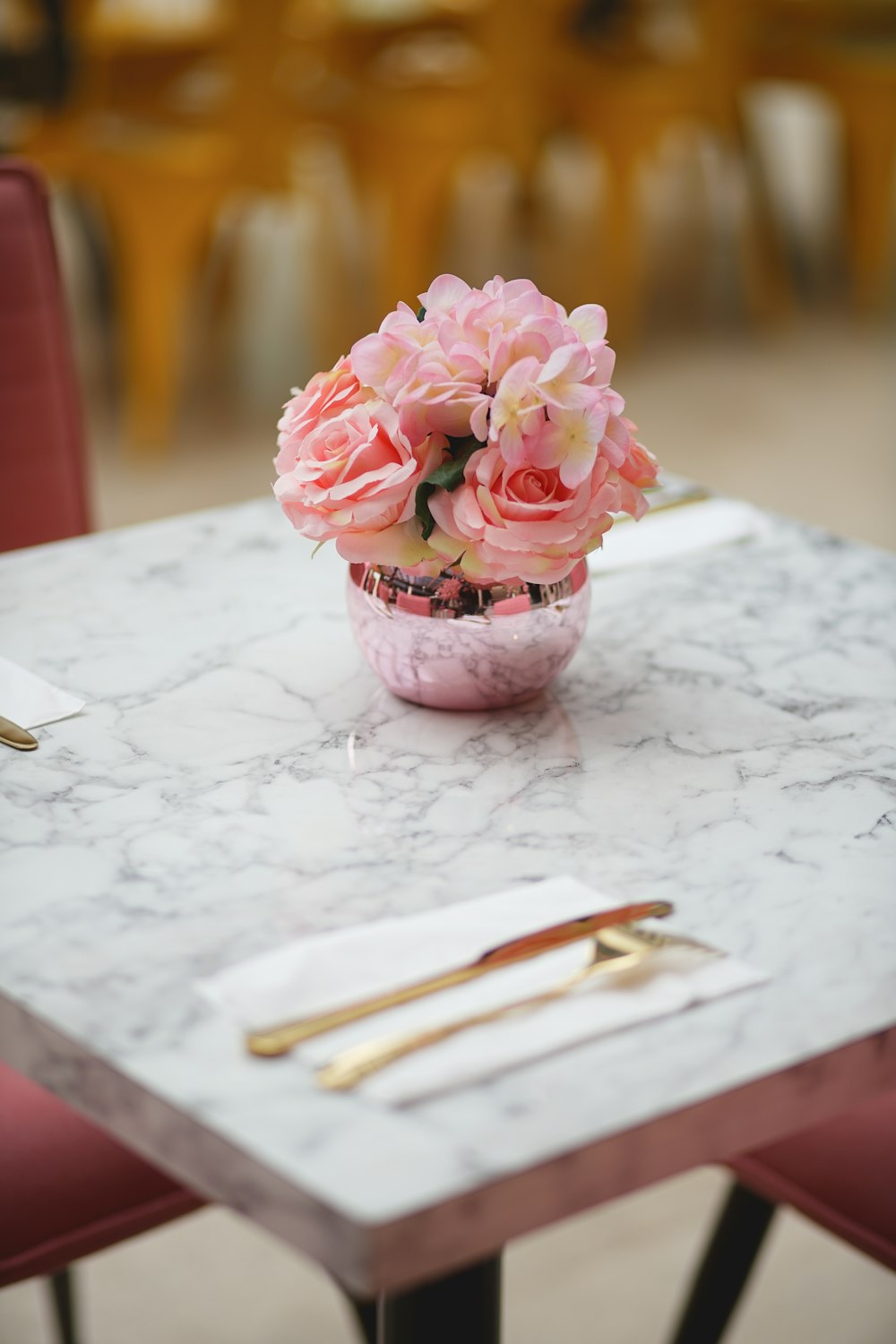 pink roses on white table