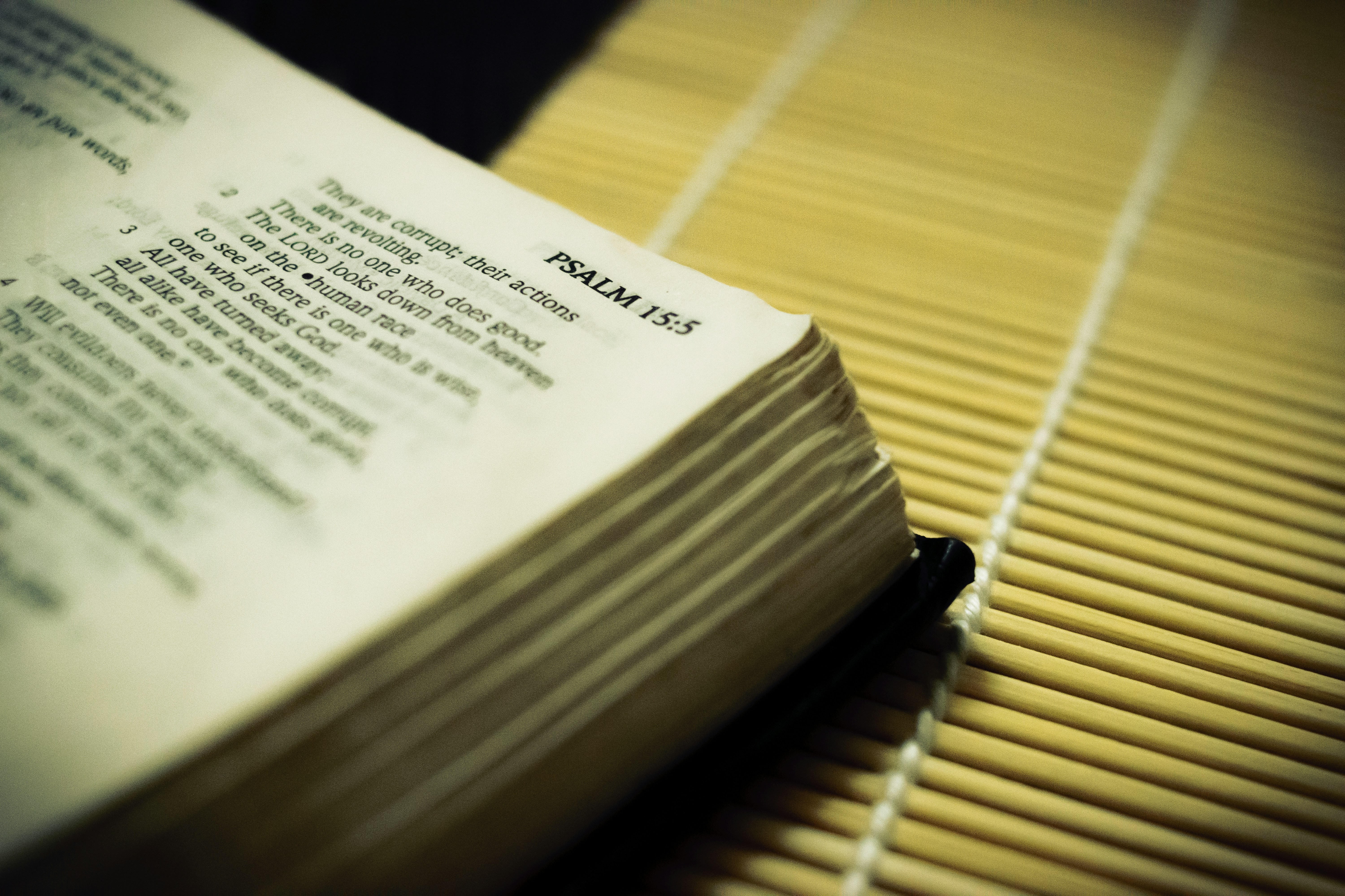 white book page on brown wooden table