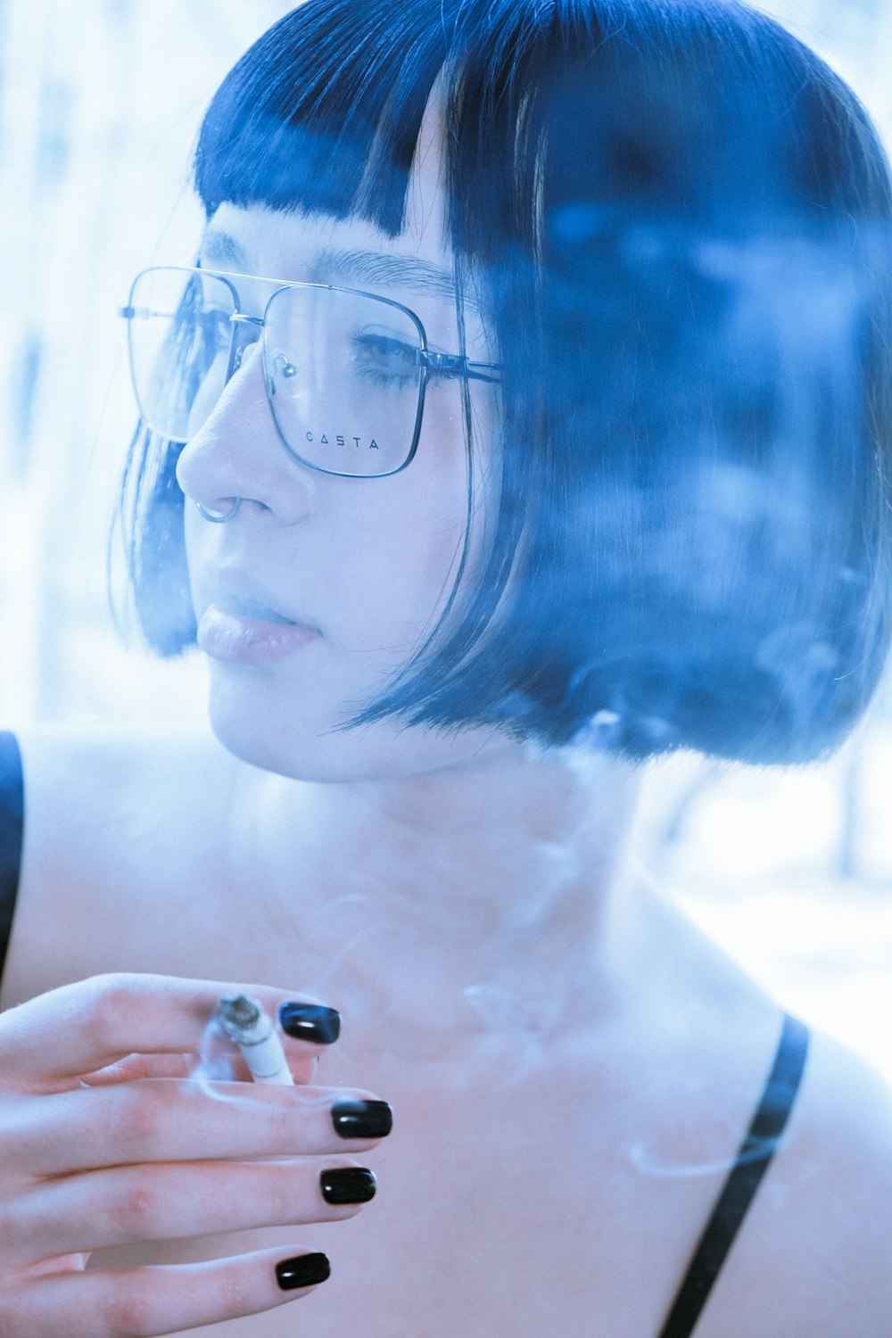 woman in black tank top wearing eyeglasses