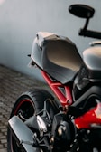 white and red sports bike