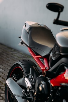 white and red sports bike