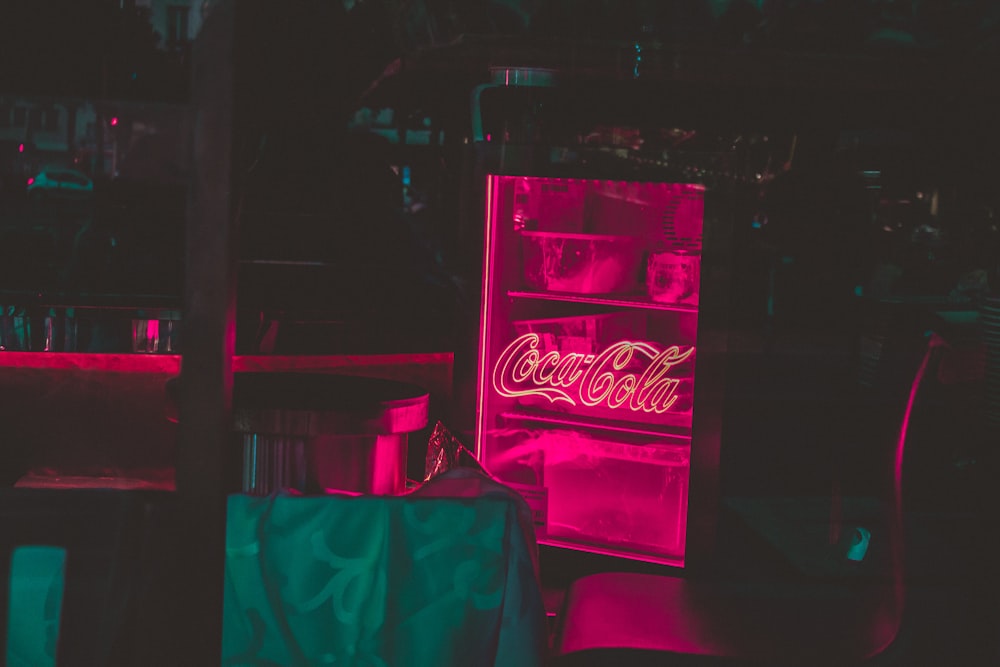 coca cola light signage turned on in room