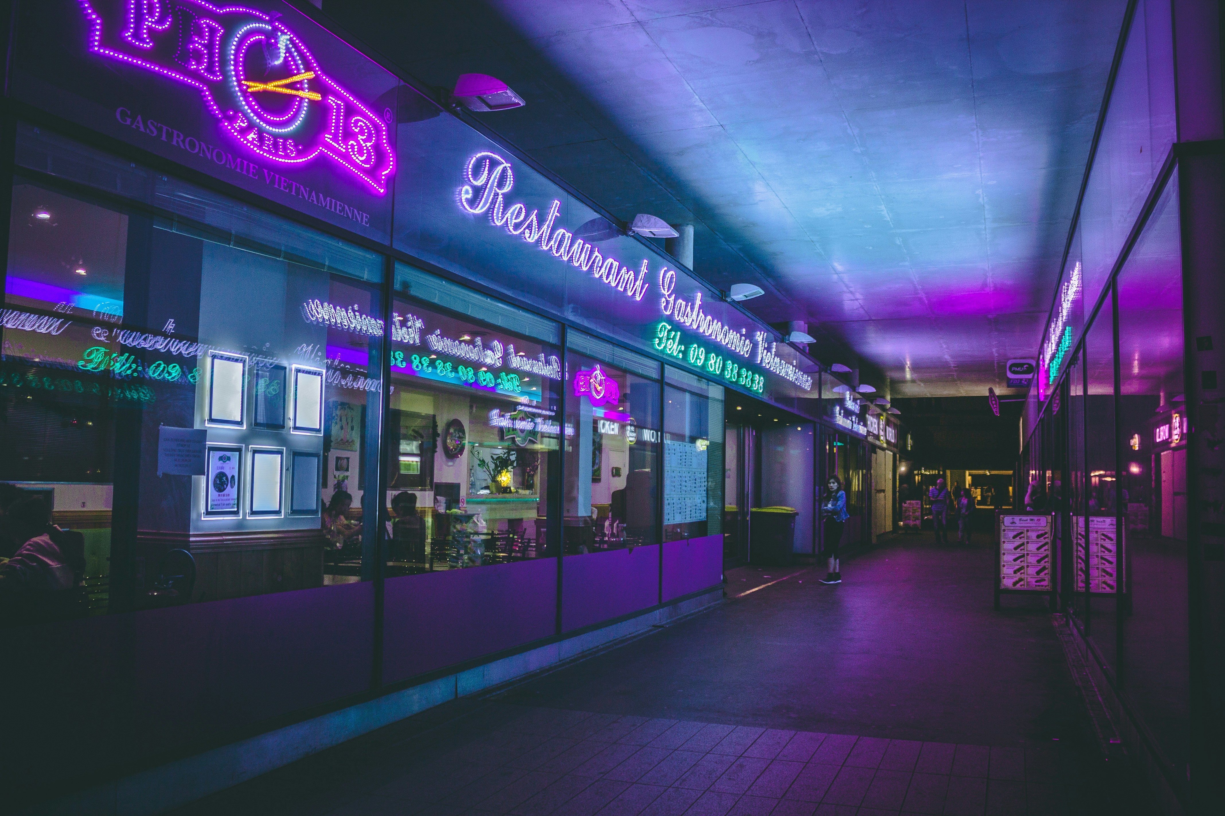 Brightly lit store front at night