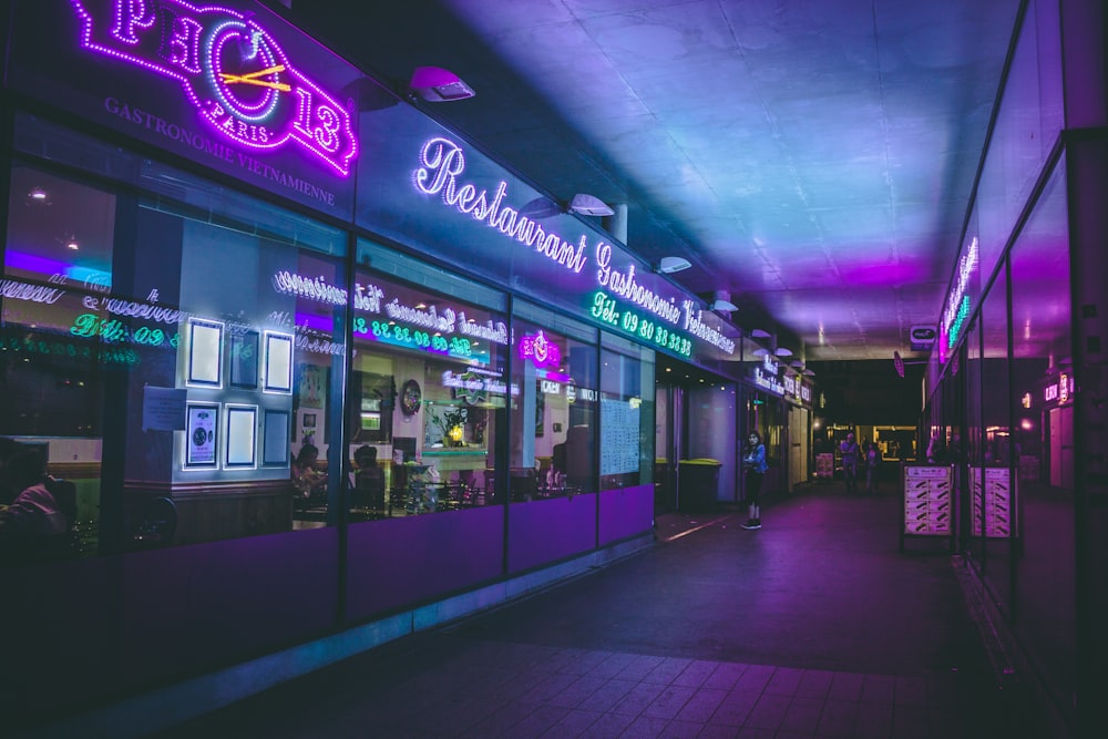 a brightly lit store front at night time