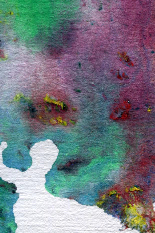 An abstract watercolor artwork featuring a blend of vibrant colors. The background has a mix of greens, purples, and reds with some yellow splatters. A white silhouette resembling an abstract figure is present in the lower left corner.