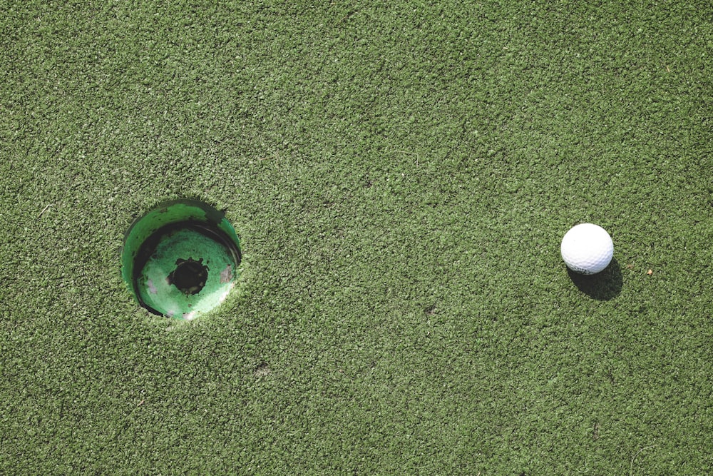 clear glass ball on green grass