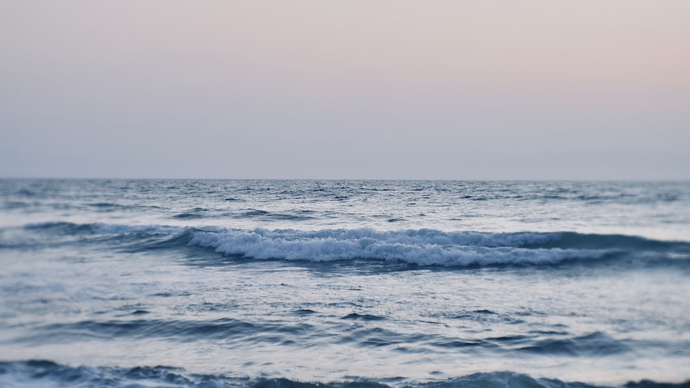 ocean waves under gray sky