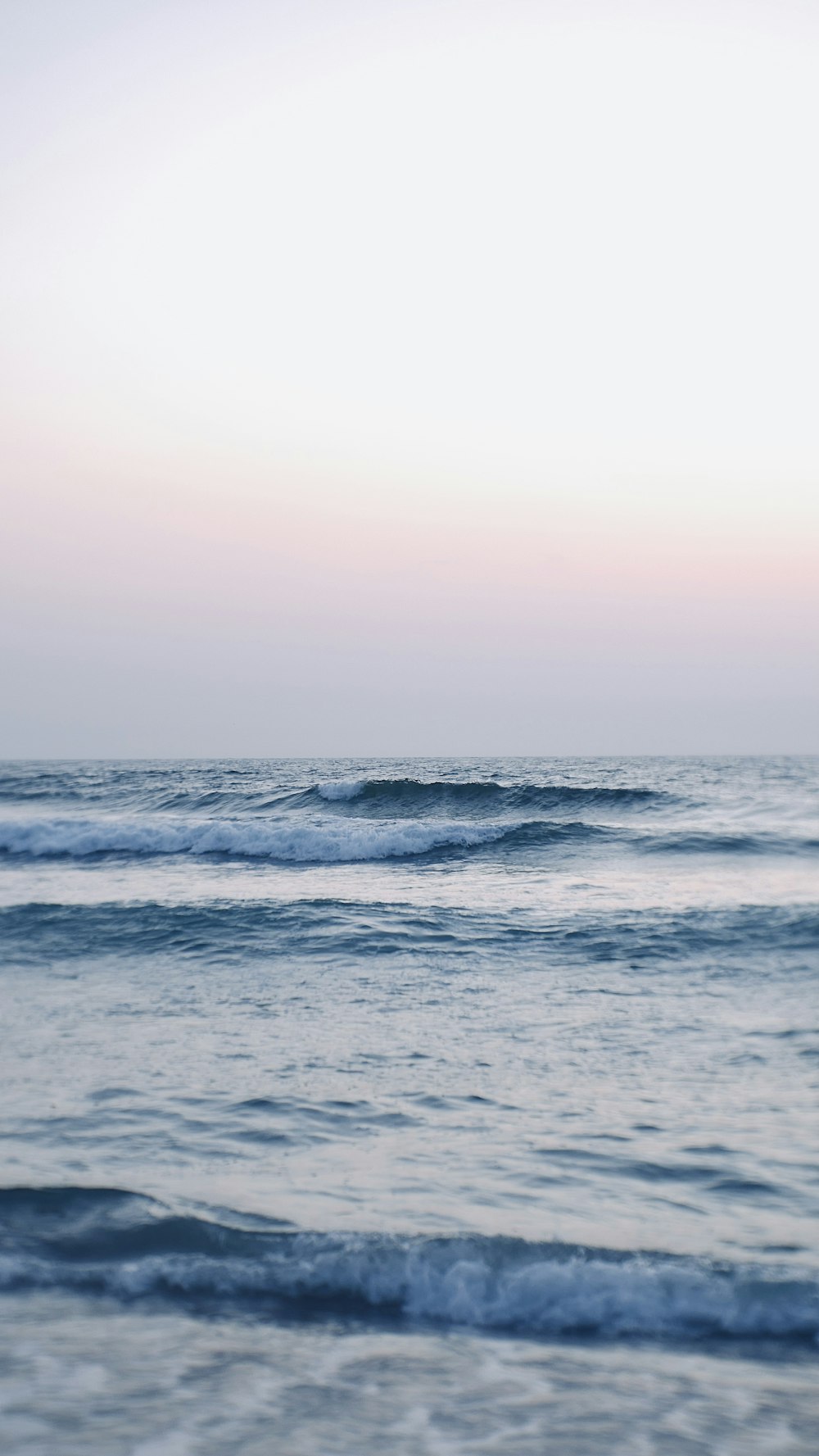 ocean waves under gray sky