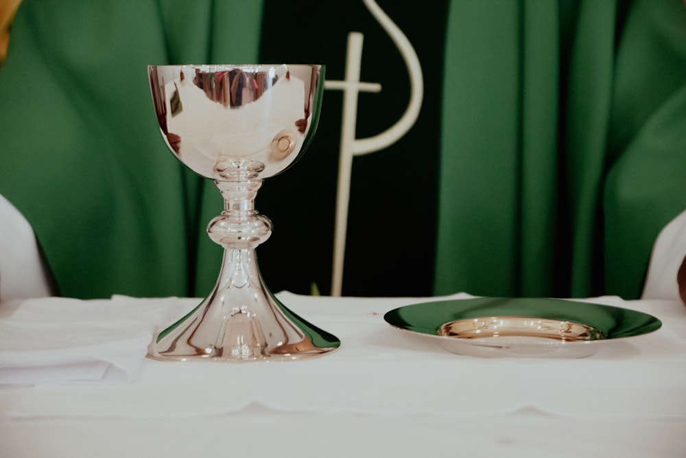 clear glass footed cup on white table