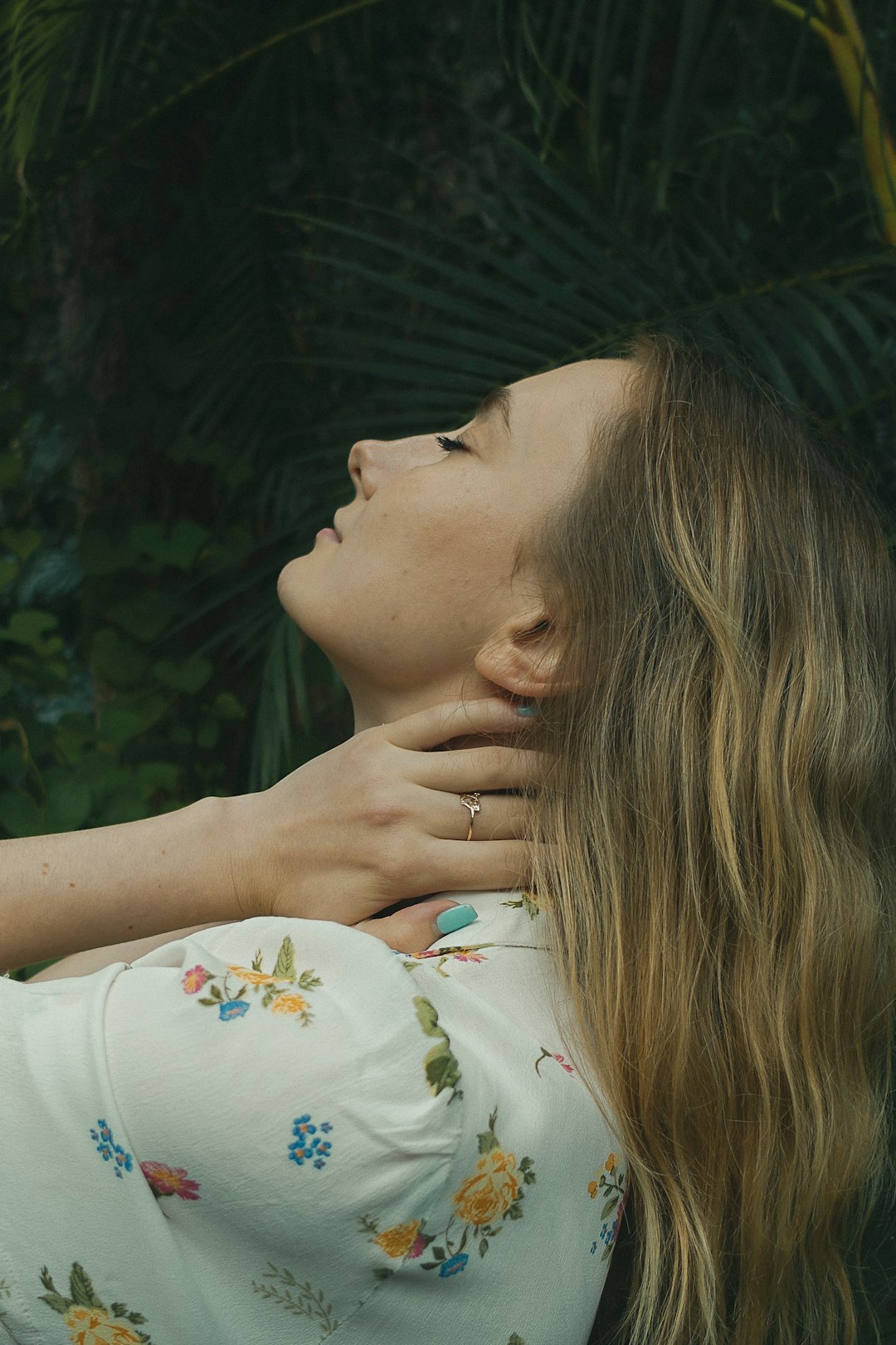 woman in white floral shirt