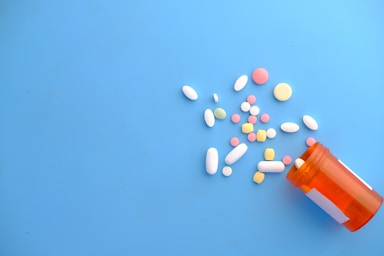 orange and white medication pill