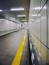 white and yellow hallway with white wall