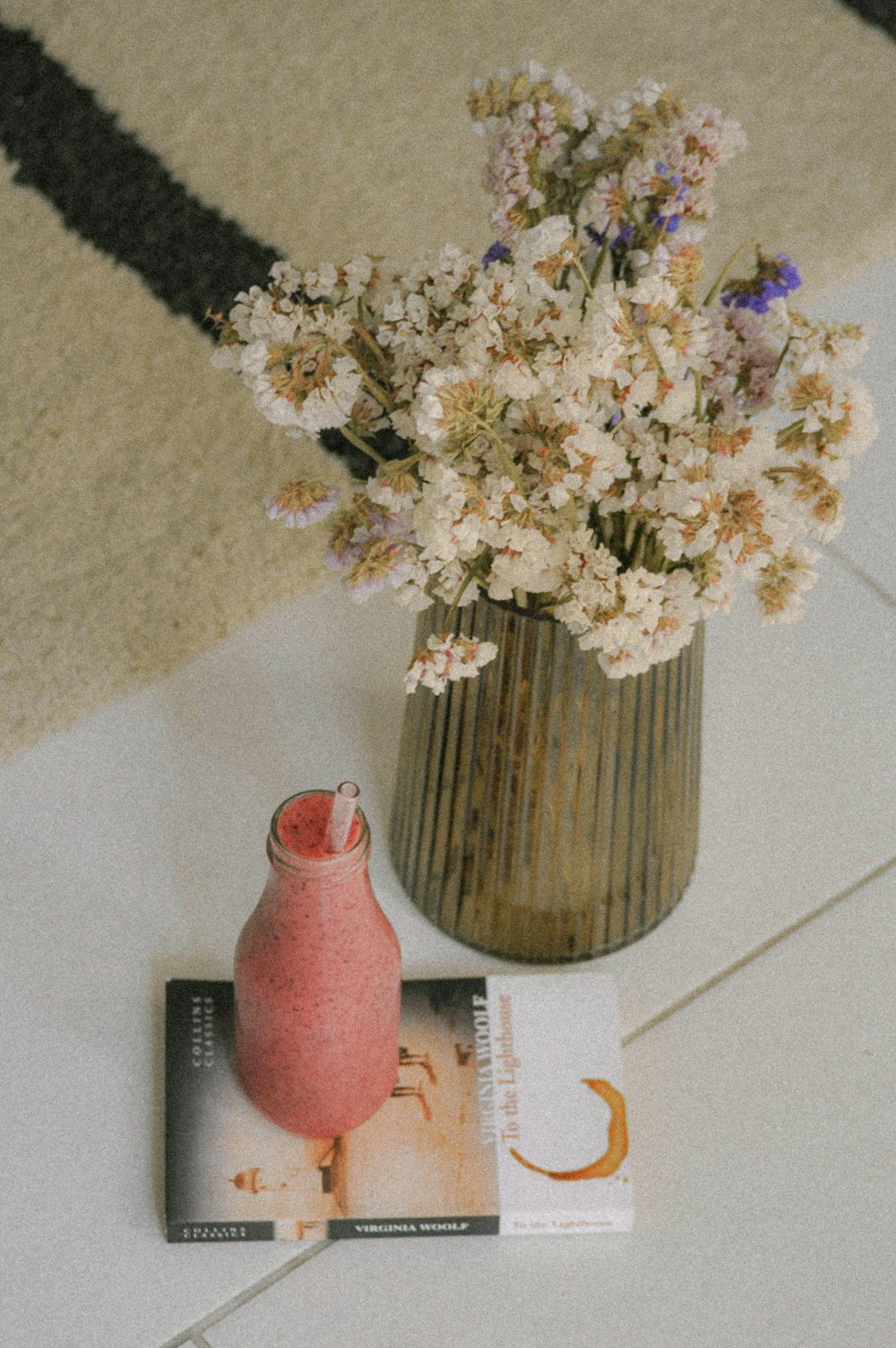 white flowers on red ceramic vase