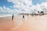 A group of tourists enjoying a beach activity together.