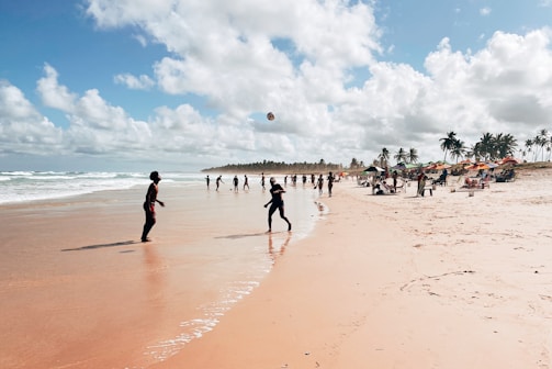 A group of tourists enjoying a beach activity together.