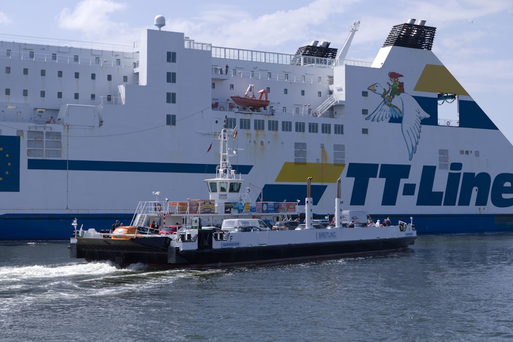 white and blue ship on sea during daytime