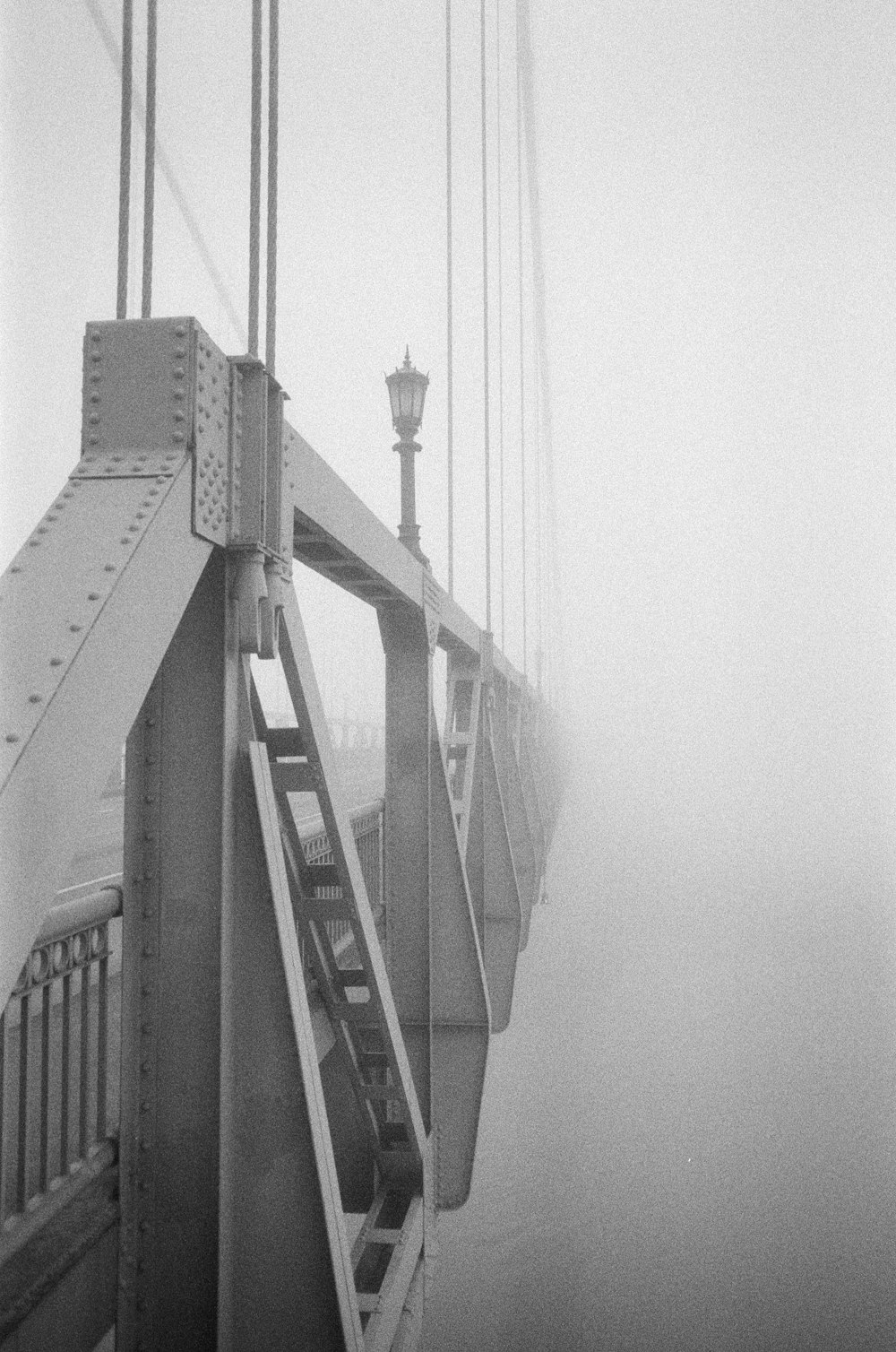 grayscale photo of a bridge