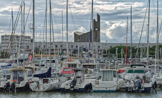 white and black boat on body of water during daytime