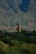 Jane Smith standing in front of a lush green landscape.