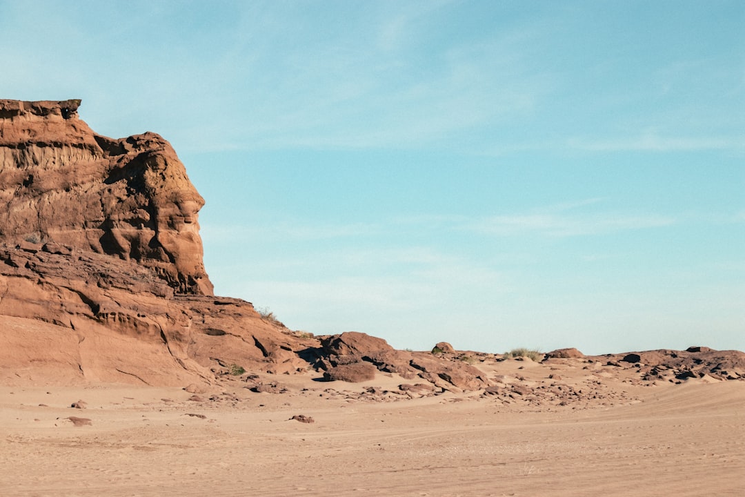 brown rock formation under blue sky during daytime