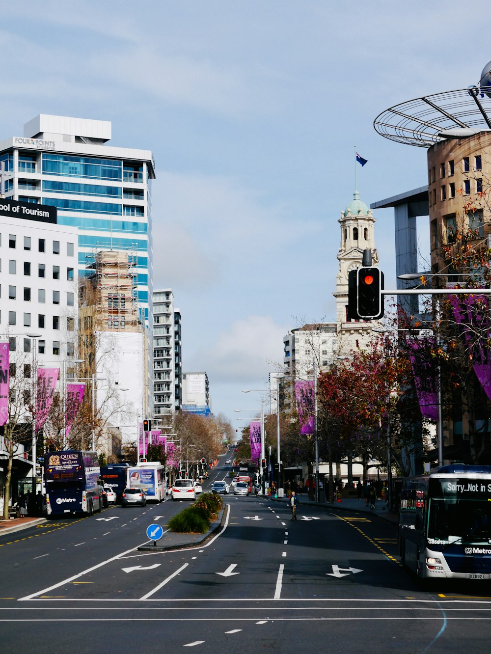 cars on road near buildings during daytime