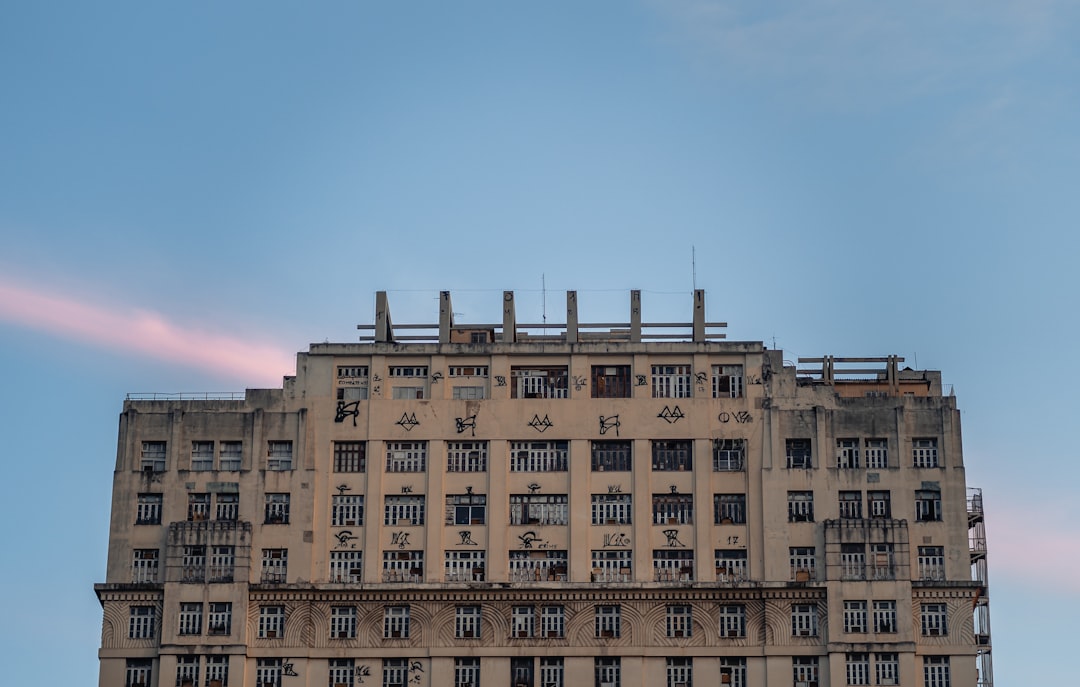 brown concrete building under blue sky during daytime