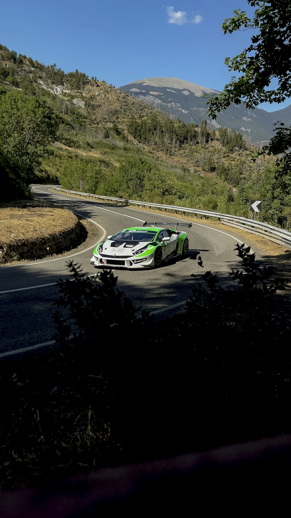 white and green car on road during daytime