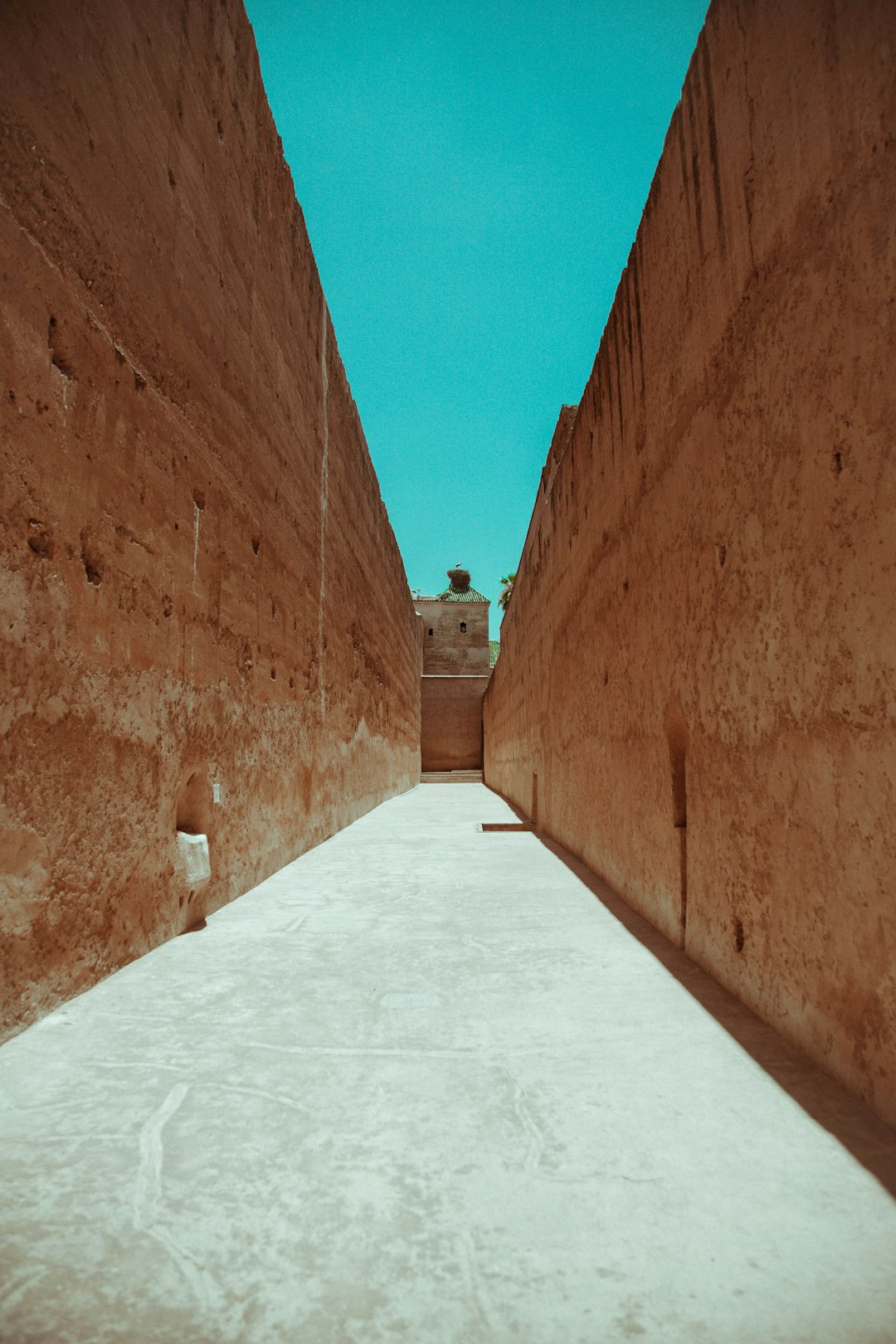 brown brick wall under blue sky during daytime