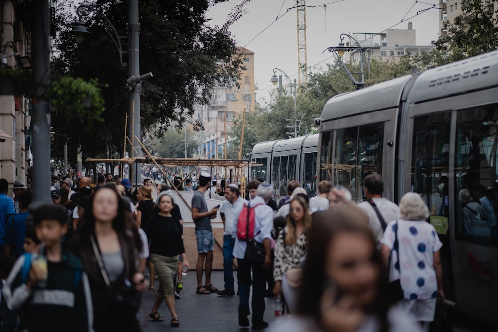 people walking on sidewalk during daytime