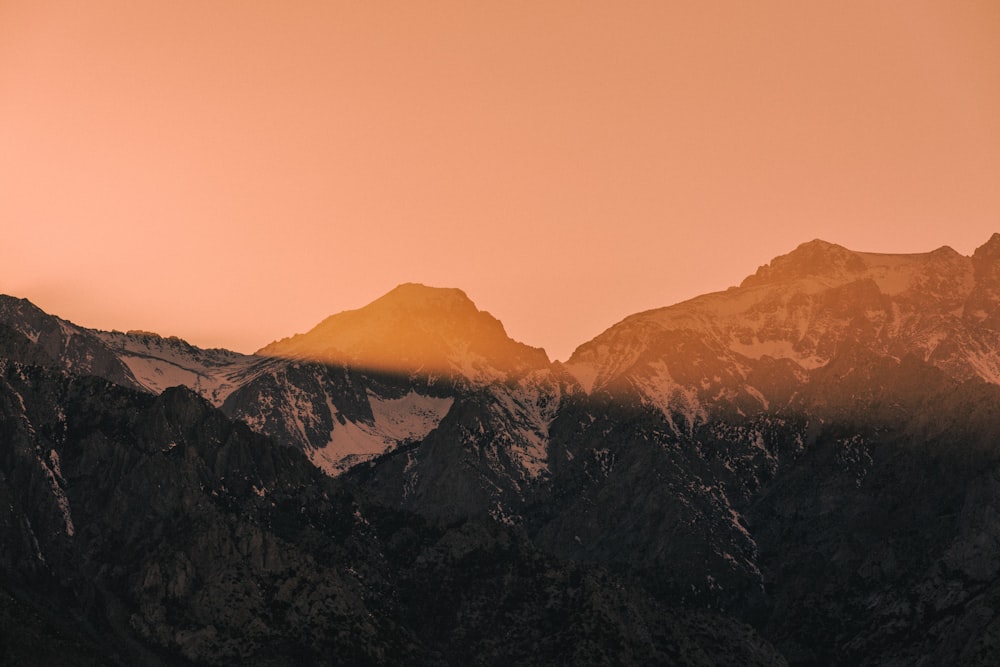 a view of a mountain range at sunset