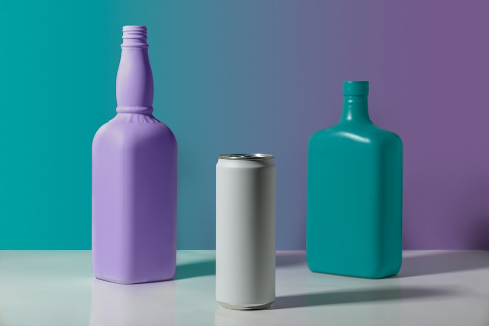 purple and white bottles on white table