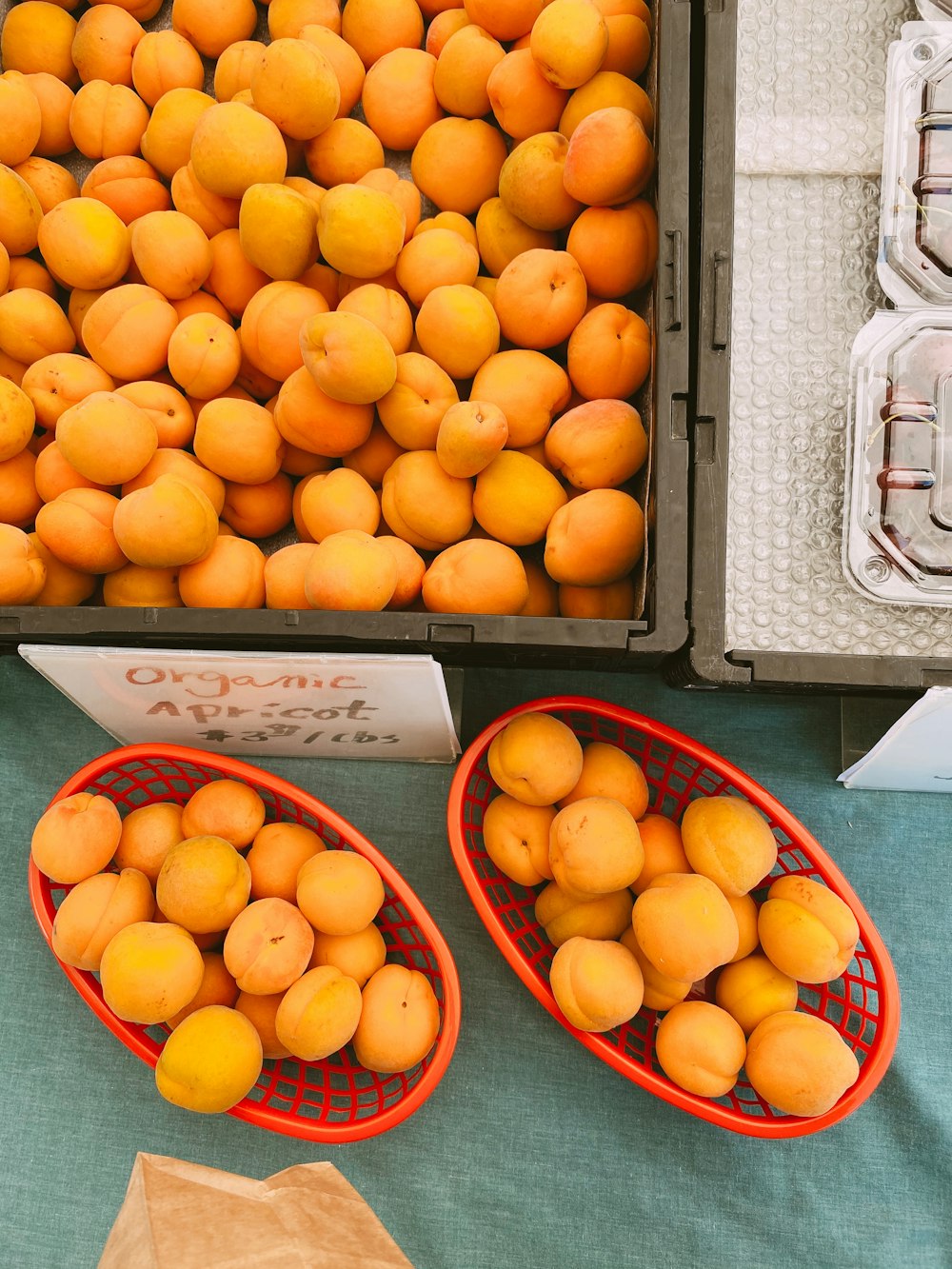 orange fruits on black plastic tray